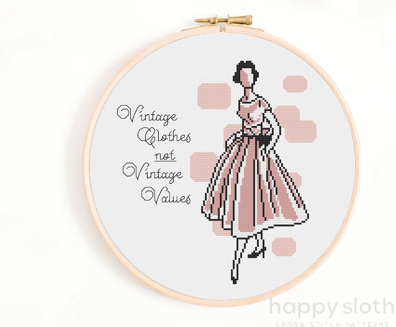 May include: Cross stitch pattern featuring a woman in a pink dress with the text "Vintage Clothes not Vintage Values".