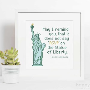 May include: A white framed print with a green and blue pixelated image of the Statue of Liberty. The text reads "May I remind you, that it does not say 'RSVP' on the Statue of Liberty." -CHER HOROWITZ