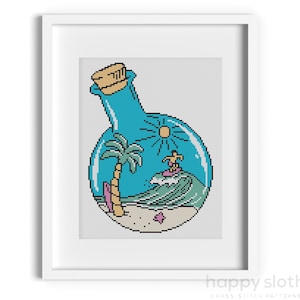 May include: A blue glass bottle with a cork stopper contains a miniature beach scene with a palm tree, a surfer riding a wave, and a yellow sun.