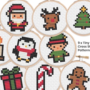 May include: Nine tiny Christmas cross-stitch patterns in wooden hoops. Designs include Santa Claus, a reindeer, a Christmas tree, a candle, a penguin, an elf, a wrapped gift, a candy cane, and a gingerbread man. The text "9 x Tiny Xmas Cross Stitch Patterns" is also visible.