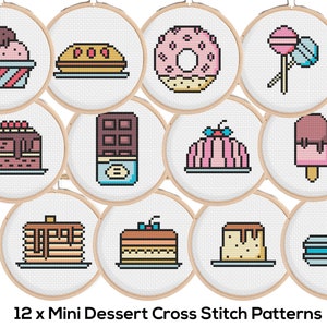 May include: Twelve mini cross stitch patterns featuring various desserts, including ice cream, cake, doughnuts, chocolate, popsicles, and macarons. Each pattern is framed in a brown wooden hoop.