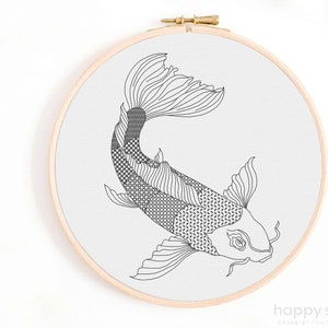 May include: Black and white line art cross stitch pattern of a koi fish in a wooden embroidery hoop.