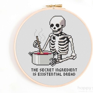 May include: A cross-stitch pattern featuring a skeleton stirring a pot of red liquid with the text "The secret ingredient is existential dread."