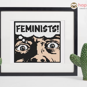 May include: Cross-stitch pattern of a person with wide eyes looking up with the word "FEMINISTS!" in a thought bubble above their head.