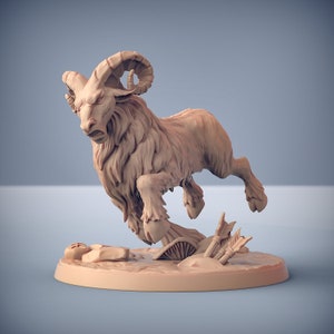 May include: A detailed miniature of a ram with large horns, leaping forward with its mouth open in a fierce expression. The ram is painted in a light brown color and is standing on a base with a few arrows and a skull.