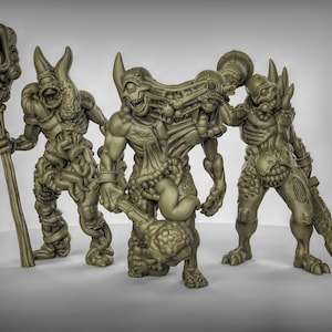 May include: Four green, grotesque, and detailed miniature figures with various weapons and body parts. The figures are made of plastic and are designed for tabletop gaming.