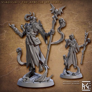 May include: A gray 3D printed miniature of a demon with horns and a staff. The demon is wearing a robe and has a skull on its staff. The miniature is on a base with a skull and a scroll. The text "VLADVVUK * THE APOSTLE OF DEATH" is at the top of the image.  The text "ALTERNATE VERSION! BALLJOINT WEAPONS!" is at the bottom of the image.