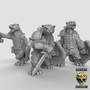 May include: Three gray fantasy miniatures of anthropomorphic bear warriors. Each figure is posed differently, one with a sword, one with a shield and sword, and one with a weapon in its hand. The figures are wearing armor and clothing. The Duncan Shadow logo is in the bottom right corner.