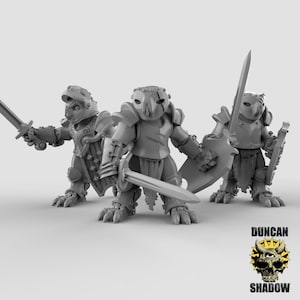 May include: Three gray, miniature, armored figures with swords and shields. The figures are posed in a fighting stance. The figures are made of plastic and are painted in a gray color.