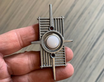 Modernist doorbell; starburst atomic age.