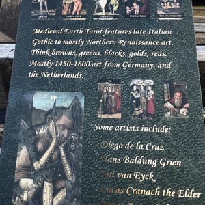 May include: A dark green tarot card featuring illustrations of tarot cards and text. The text describes the Medieval Earth Tarot, its art style, and the artists involved. The card's color palette includes browns, greens, blacks, golds, and reds.