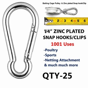 May include: A silver-colored zinc-plated snap hook with a spring-loaded gate. The image includes a batting cage pulley with a snap hook next to a yellow measuring tape showing a length of 6 inches, and text stating 1/4 inch zinc plated snap hooks/clips.