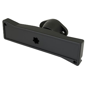 May include: A black plastic component with a rectangular base and a circular, raised section. The base has a star-shaped hole and two smaller holes. The component is designed for mounting or connecting to another part.