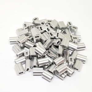 May include: A pile of silver metal cable crimp sleeves. The sleeves are cylindrical with a small hole in the center.