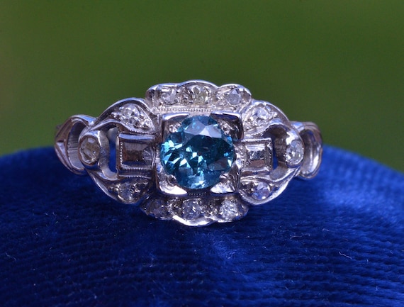 Antique Platinum Ring set with 0.52 carat Fancy Deep Blue Diamond