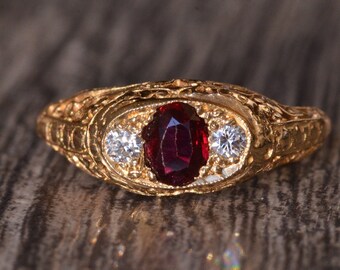 14 Karat Yellow Gold Filigree Ring set with Garnet