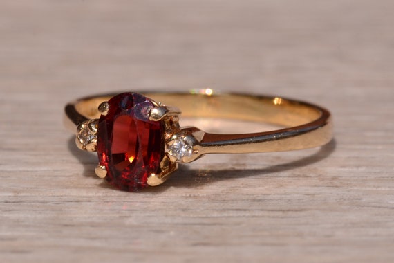 Garnet and Diamond Three Stone Ring In Yellow Gold - image 2