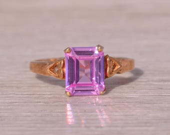 Anillo de topacio rosa en oro amarillo