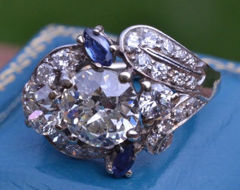 Platinum Art Deco Ring set with 2.50 Carat Center, 1.50 Carats in Mounting, and Sapphires