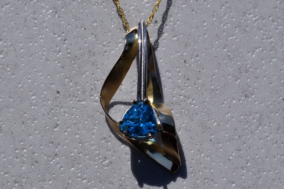 Signed Two Tone Pendant with Blue Topaz