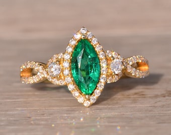 Marquise Emerald and Natural Diamond Ring in Yellow Gold