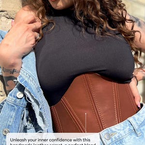 May include: A brown leather corset with vertical stitching and a curved shape. The corset is worn over a black top and under a denim jacket. The image includes the text: "Unleash your inner confidence with this handmade leather corset, a perfect blend of elegance, boldness, and functionality."