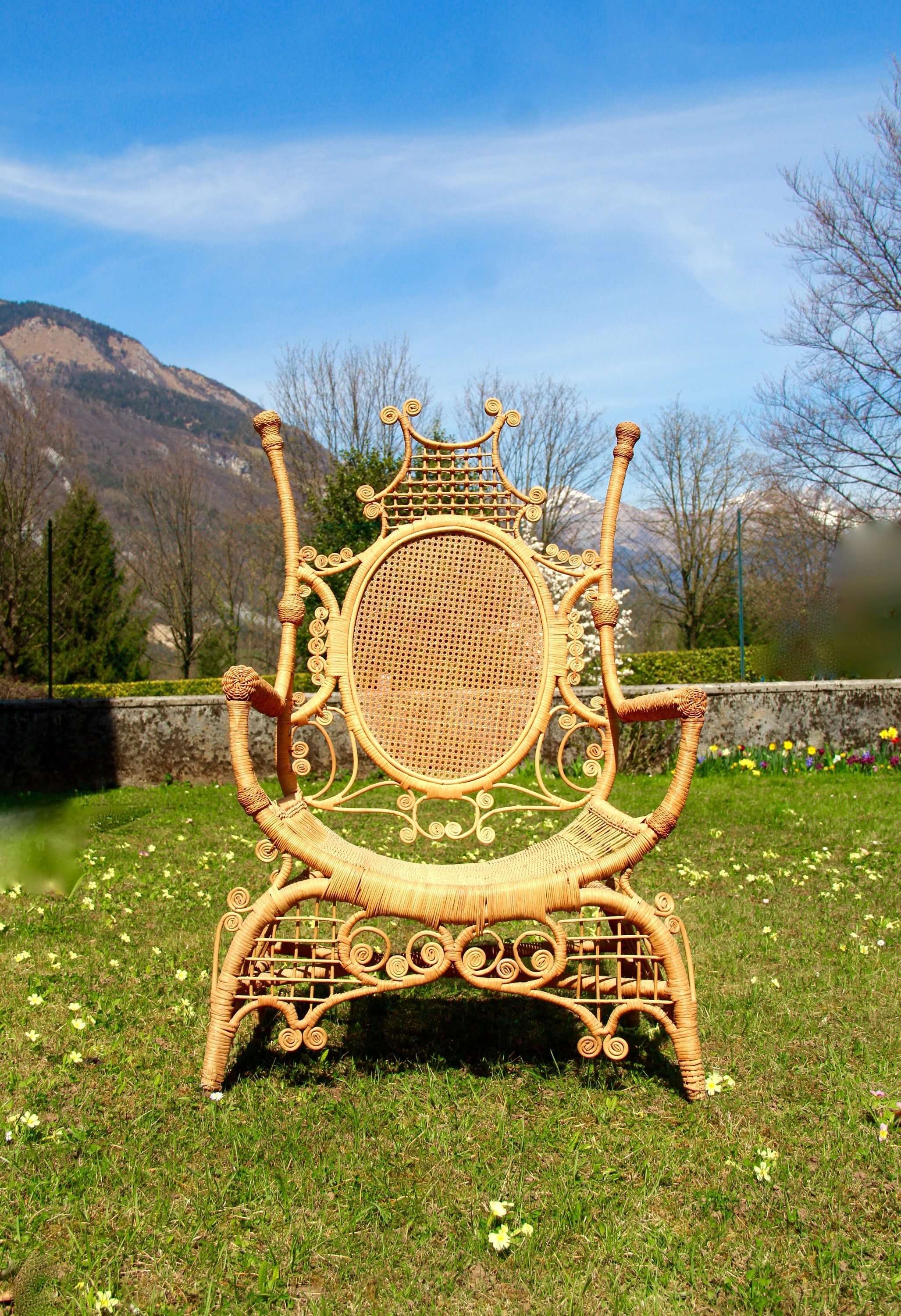 Antique wicker chair with cheap springs