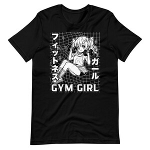 May include: Black and white graphic t-shirt featuring an anime girl lifting weights with the text "Gym Girl" and Japanese characters.