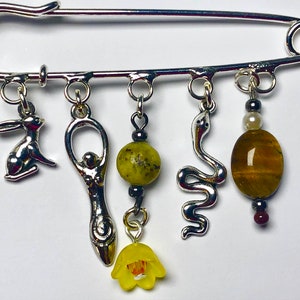 Ostara brooch charms and crystals goddess hare serpent flower charms serpentine tigers eye egg crystal spring equinox