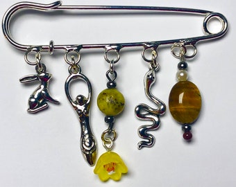 Ostara brooch charms and crystals goddess hare serpent flower charms serpentine tigers eye egg crystal spring equinox