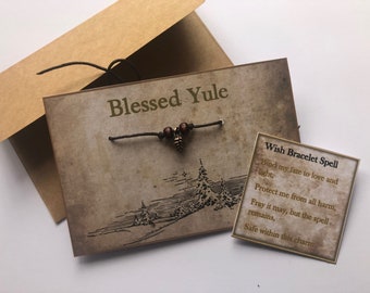 Yule midwinter solstice wish bracelet on a card pine cone bead bracelet Kraft envelope and spell card