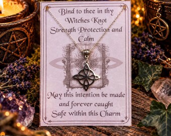 May include: A silver-toned metal pendant featuring a Witches Knot design on a delicate chain, displayed on a rectangular card with the text: Bind to thee in thy Witches Knot Strength Protection and Calm. May this intention be made and forever caught Safe within this Charm.