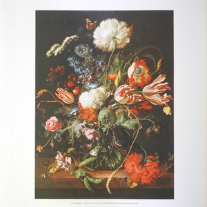 May include: A still life painting of a vase filled with a variety of flowers, including tulips, carnations, and roses. The vase is on a table with a few pieces of wheat and a green pea pod. The painting is by J. de Heem, "Flowers in a Vase", oil on copper, circa 1640.