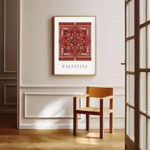 Digital wall art featuring a traditional Palestinian Tatreez embroidery pattern in vibrant red and black. The intricate geometric design symbolizes Palestinian cultural heritage, with the word "Palestine" elegantly displayed below.