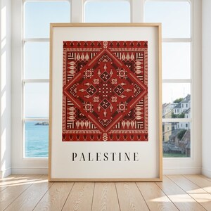 Digital wall art featuring a traditional Palestinian Tatreez embroidery pattern in vibrant red and black. The intricate geometric design symbolizes Palestinian cultural heritage, with the word "Palestine" elegantly displayed below.