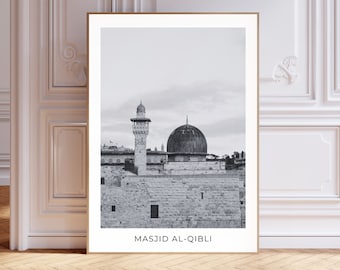 May include: A black and white photograph of a mosque with a dome and a minaret. The mosque is called "Masjid Al-Qibli".