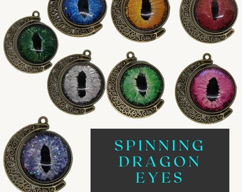 Spinning moon and double dragon eye in brass colored pendant tray