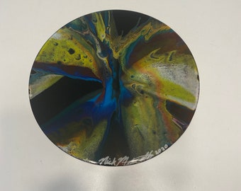 The spin #2 original painting by Nick Metcalf on 12”Round wood panel coated in epoxy resin