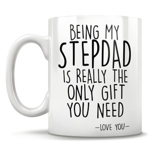 May include: White ceramic coffee mug with a black inscription that reads "Being my Stepdad is really the only gift you need -Love you-"