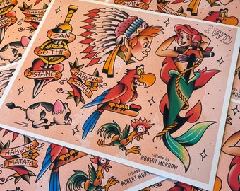 May include: A collection of tattoo art prints featuring colorful illustrations of classic cartoon characters and phrases. Designs include Peter Pan, Ariel, a parrot, and the words "Hakuna Matata" and "I can go the distance."