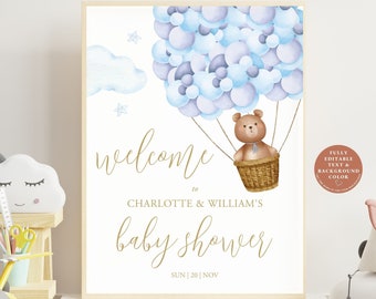 Könnte beinhalten: Ein druckbares Willkommens-Schild für eine Babyparty mit einem blauen und violetten Aquarell-Ballon-Design. Ein Teddybär sitzt in einem Korb, der an den Ballons befestigt ist. Der Text lautet "Willkommen zu Charlotte & Williams Babyparty Sun | 20 | Nov".