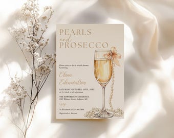 May include: A bridal shower invitation with the text "Pearls and Prosecco." The invitation features a champagne glass with a bow and pearl accents. The invitation includes the name Olivia Edwardson, date, time, and location.