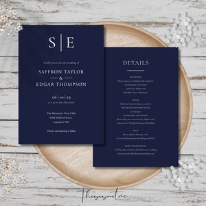 May include: Navy blue wedding invitation with white text. The invitation includes the couple's names, wedding date, and location. The invitation also includes details about the reception and hotel.