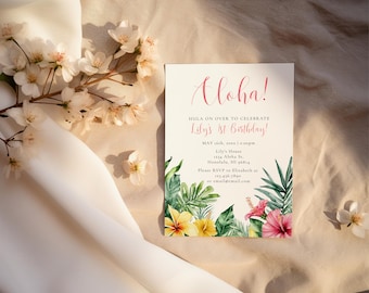 May include: A cream-colored invitation with the word "Aloha!" in pink script. The invitation is for Lily's 1st birthday and features tropical floral and foliage illustrations in yellow, pink, and green. The invitation includes event details.