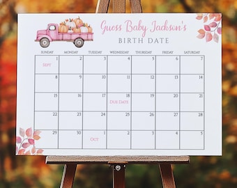 May include: A white calendar on a wooden easel with the text "Guess Baby Jackson's BIRTH DATE." A pink truck carries pumpkins. The calendar grid shows the months of September and October, with the "DUE DATE" marked.