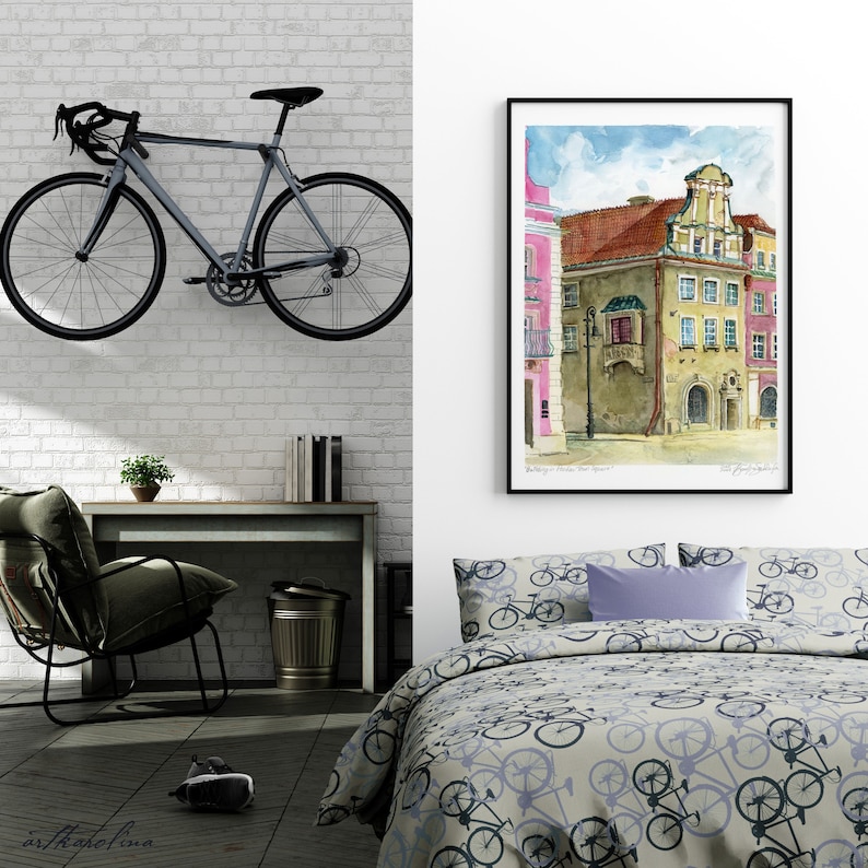 May include: A watercolor painting of a building with a pink facade and a brown roof. The building has a balcony with a wrought iron railing and a sign that says "Brauerei". The painting is framed in black and hanging on a white wall.