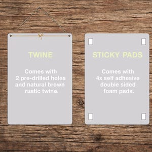 An informational graphic on a wooden background showing hanging options, featuring a gray rectangle with text explaining twine and a gray rectangle with text explaining sticky pads.