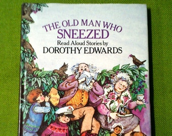 Può includere: Un'illustrazione colorata sulla copertina di un libro per bambini intitolato "Il vecchio che starnutava" di Dorothy Edwards. L'illustrazione presenta un gruppo di bambini, un cane e un uomo anziano che starnutisce.
