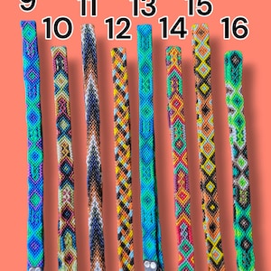 May include: Eight woven fabric straps labeled 9 through 16, featuring intricate geometric patterns in vibrant colors including neon green, blue, orange, pink, and black. Each strap includes a metal clasp at the bottom for secure attachment.