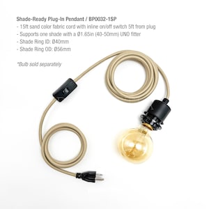 May include: A sand-colored plug-in pendant light with a black on/off switch and a black plug. The cord is 15ft long. The pendant supports one shade with a 1.65in UNO fitter. The shade ring ID is 40mm, and the OD is 56mm. The text says "Shade-Ready Plug-In Pendant".